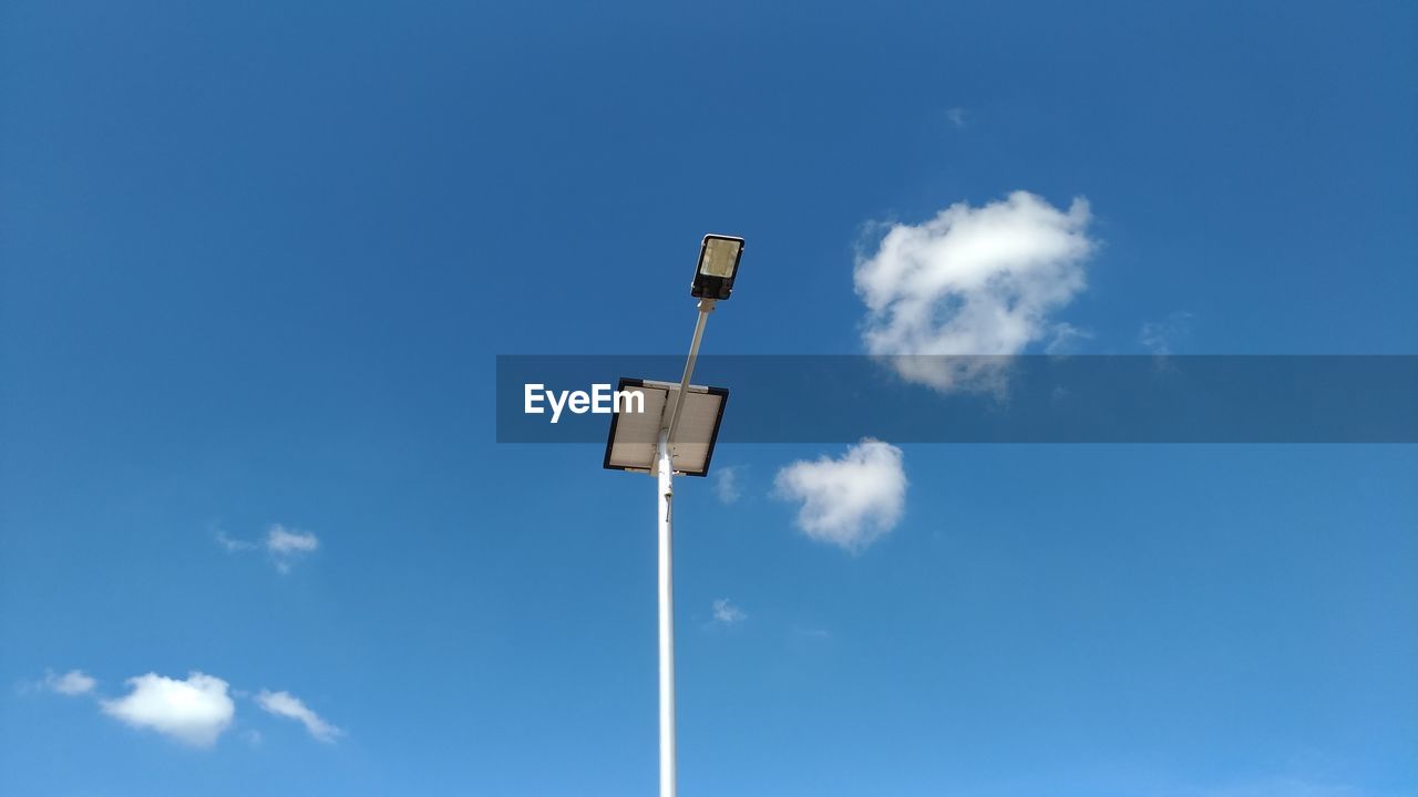 Low angle view of street light against sky