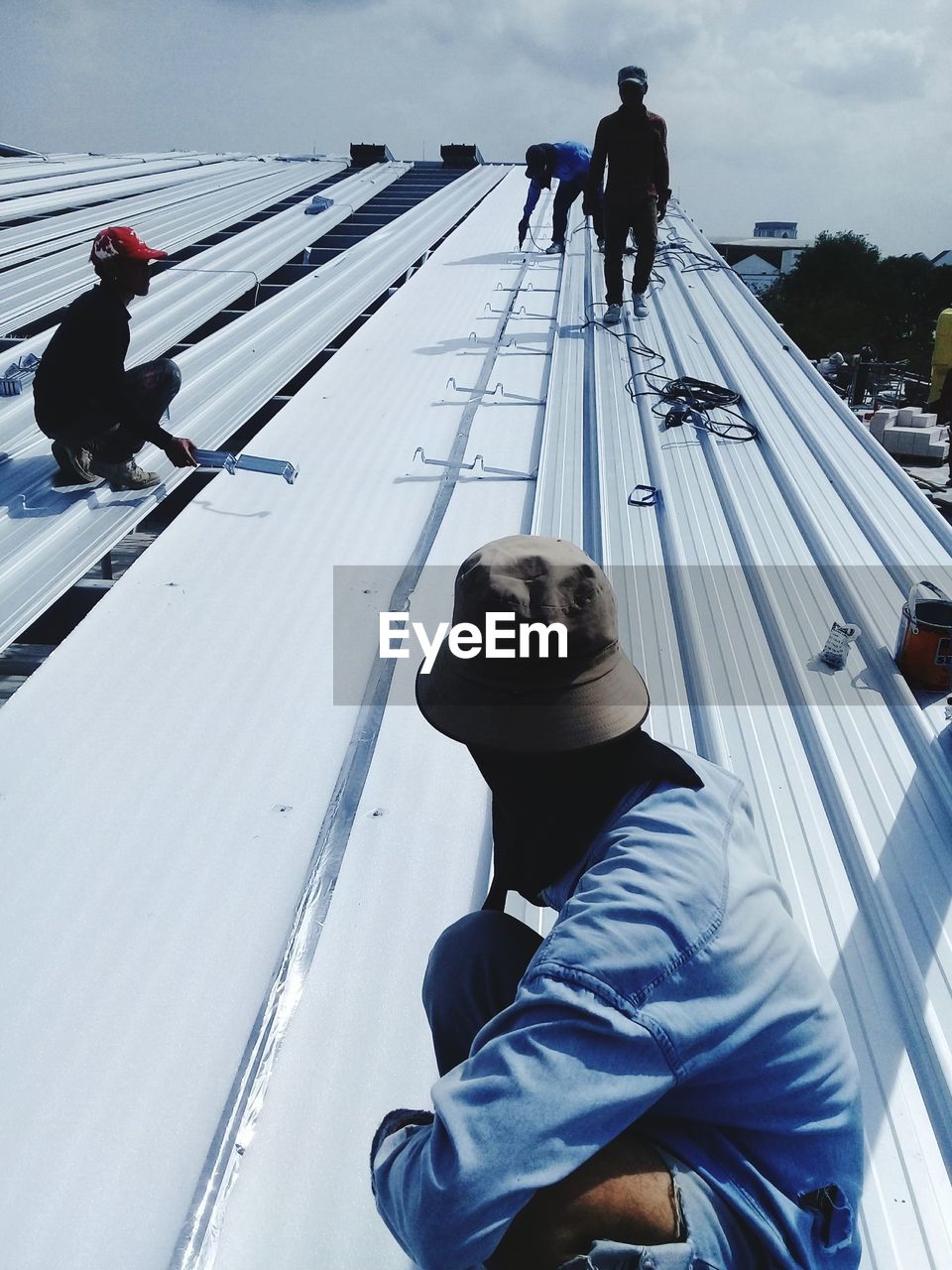 Construction workers working on roof 