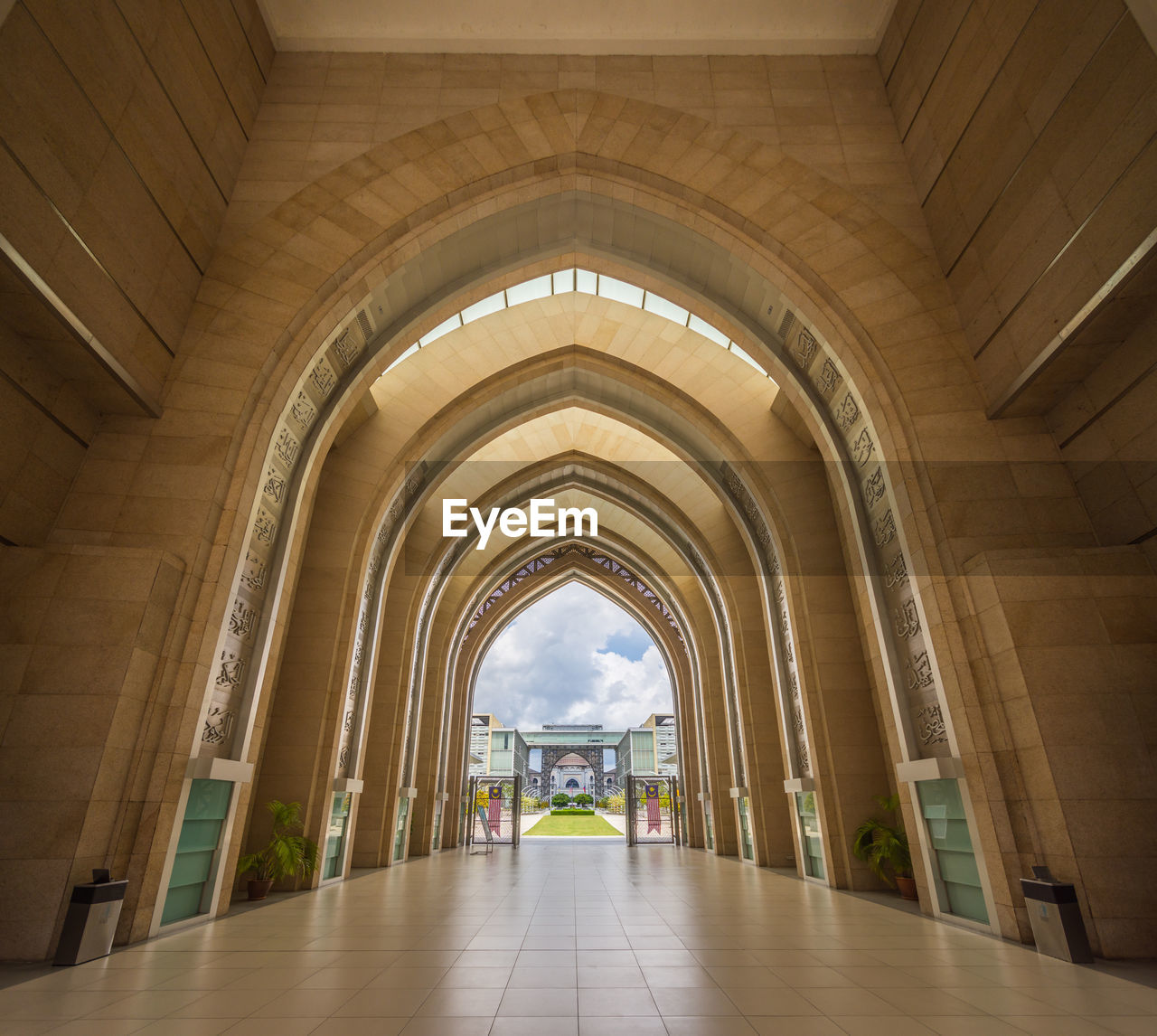 MAN SEEN THROUGH ARCHWAY