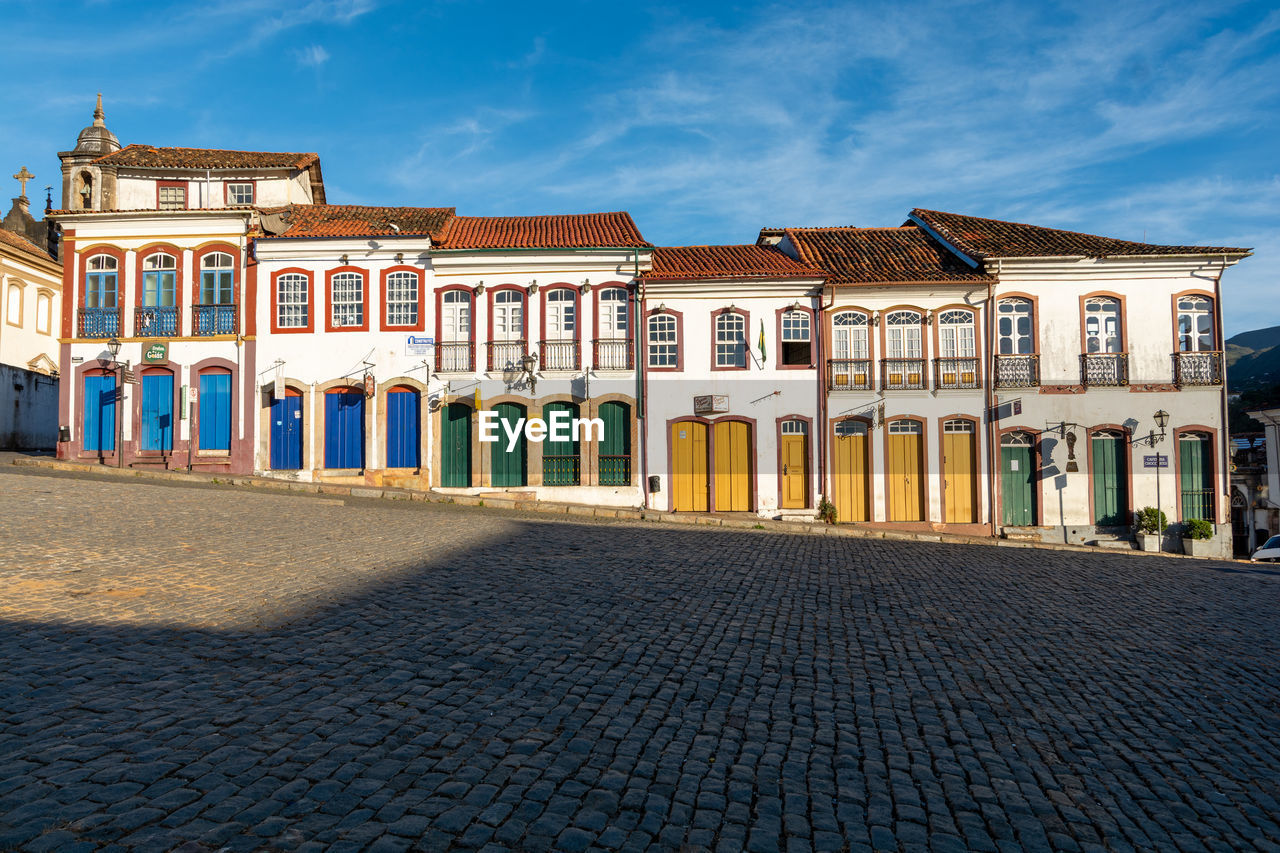 Exterior of building by street against sky