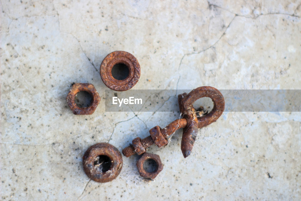 Close-up of rusty metals on floor