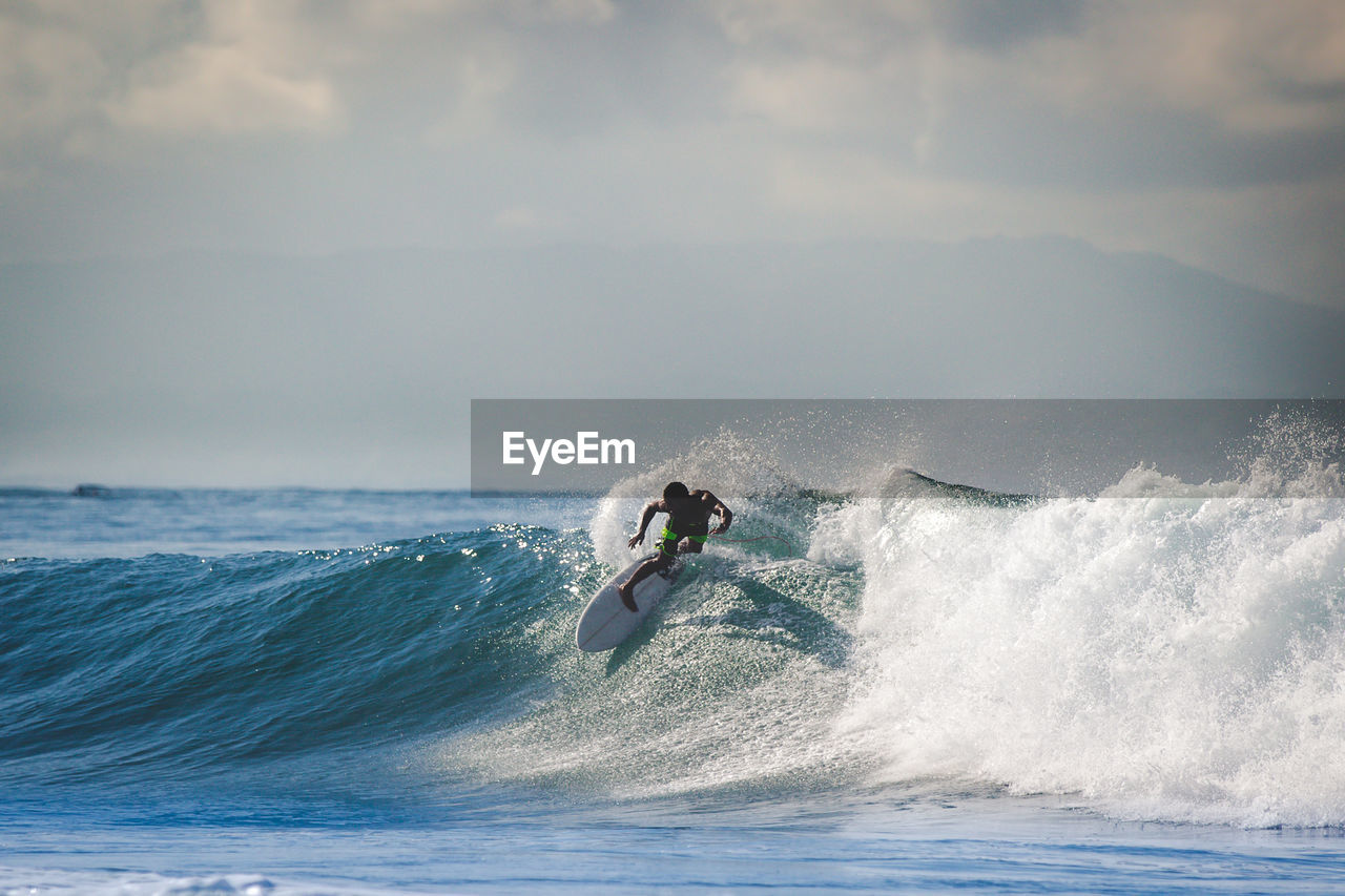 Full length of man surfing in sea