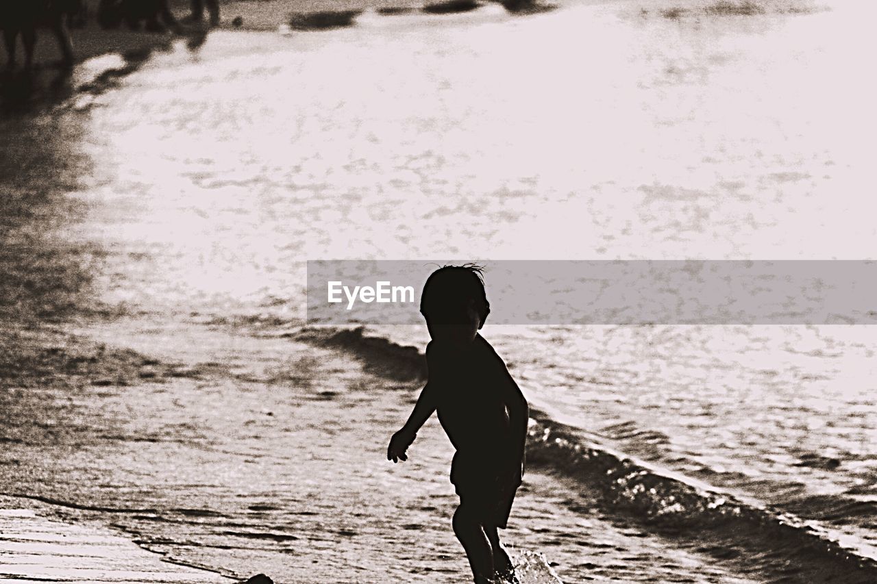 Boy running on beach