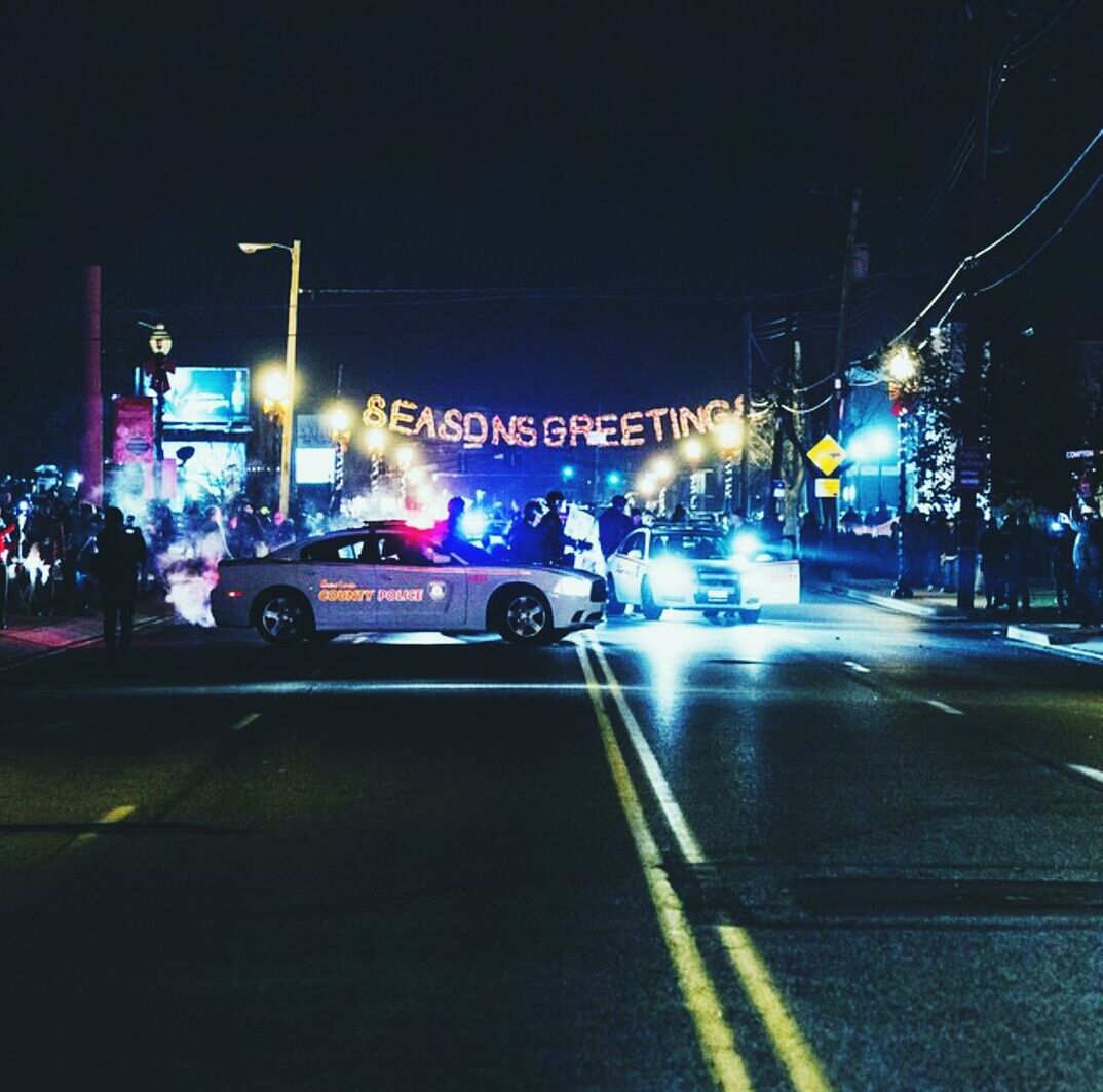 Vehicles in city road at night