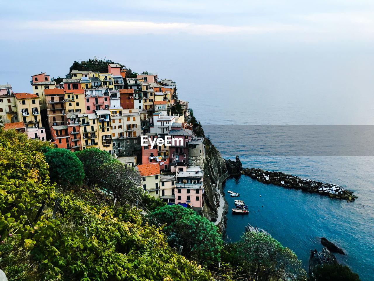 High angle view of buildings by river at cinque terre