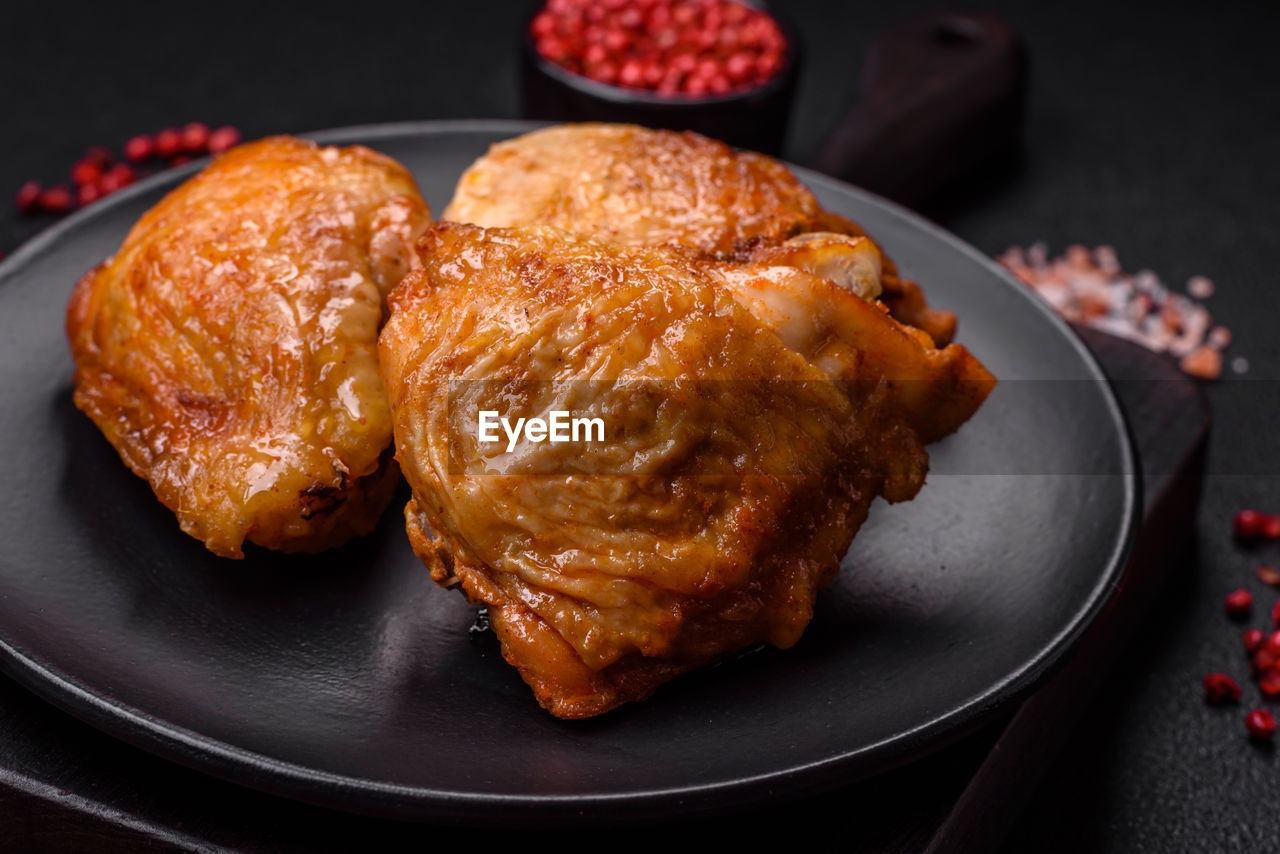 food, food and drink, meat, fried food, dish, produce, no people, freshness, meal, studio shot, roasted, chicken, healthy eating, black background, chicken meat, fruit, indoors, fast food, cuisine, plate, close-up, dessert, dinner, white meat, wellbeing, still life, dark