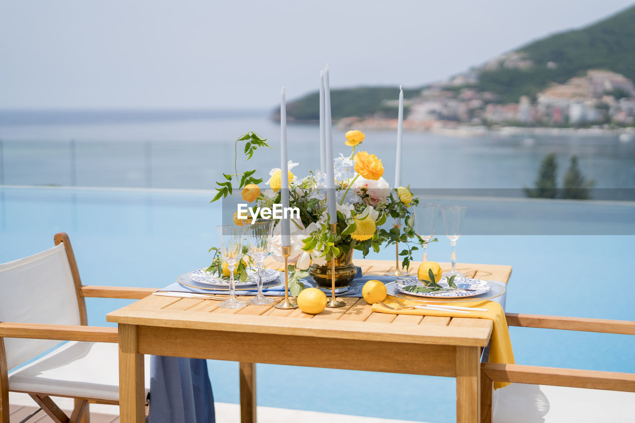 potted plant on table by lake