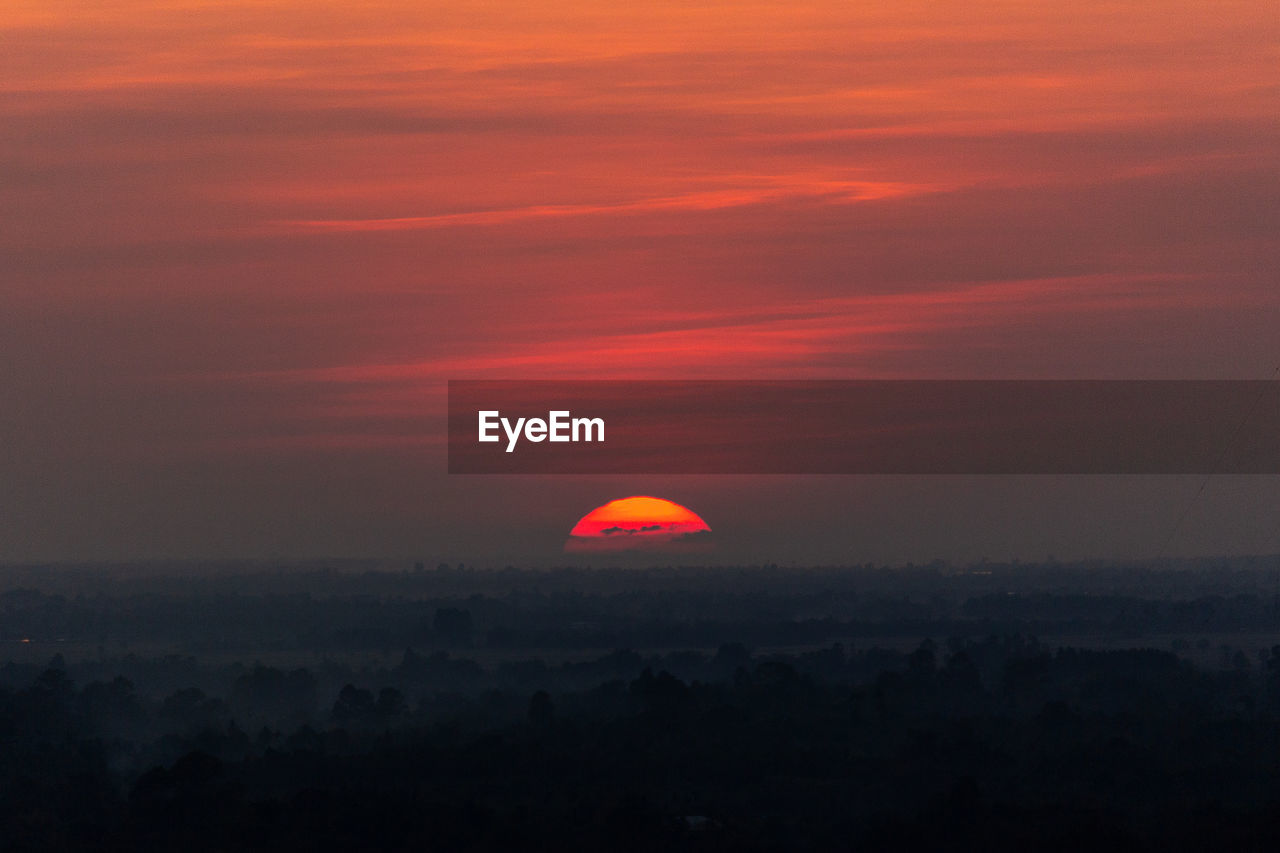 Scenic view of dramatic sky during sunset