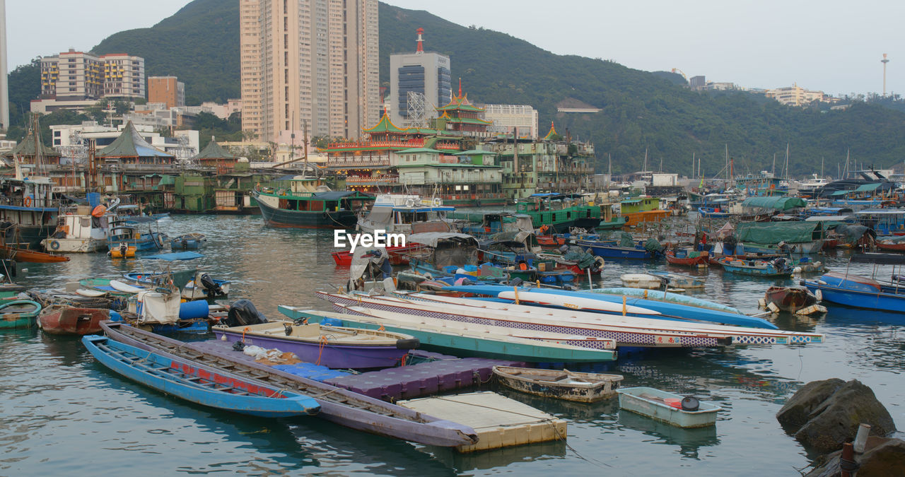 BOATS MOORED IN HARBOR