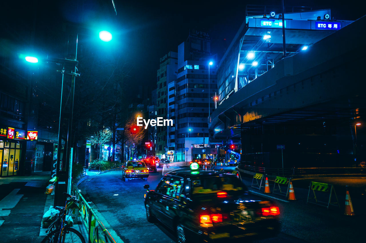 Traffic on city street at night