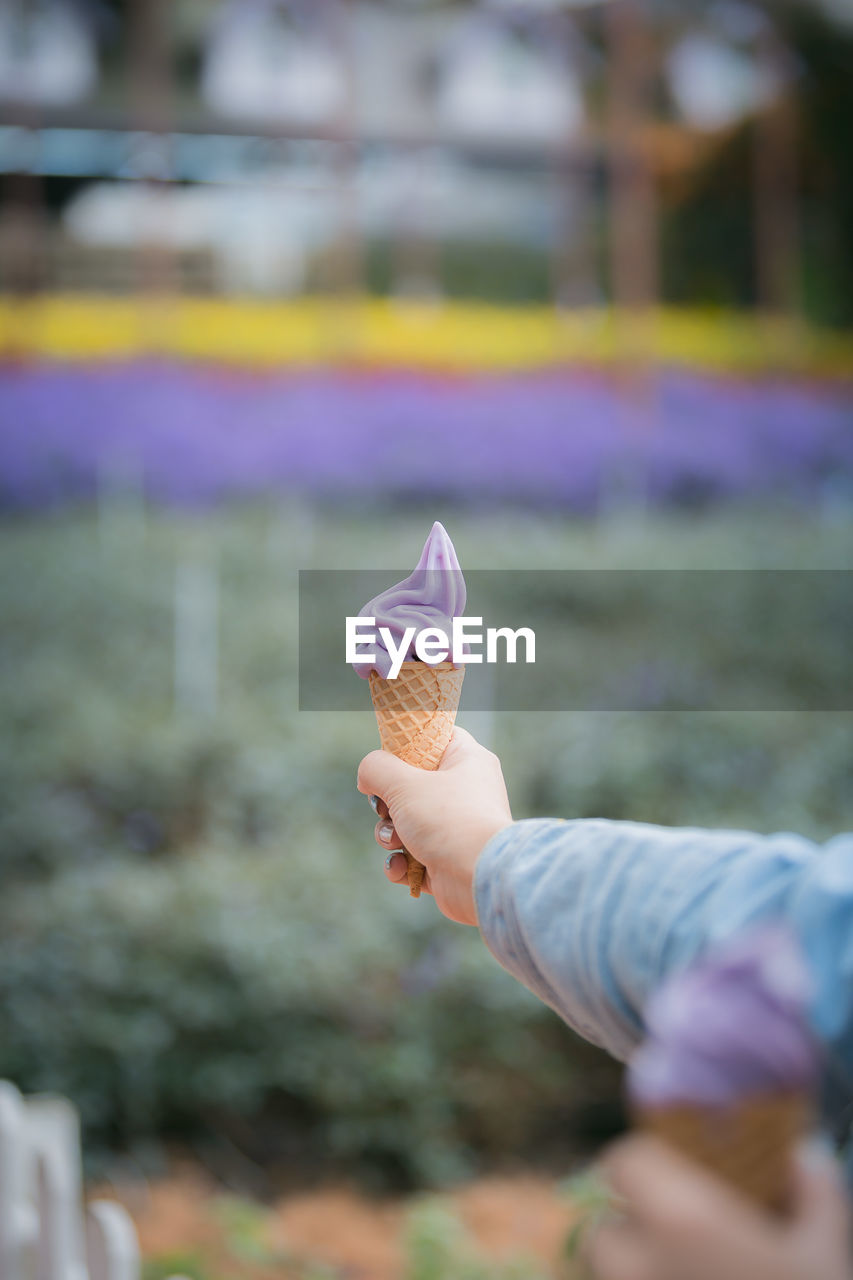 Woman holding ice cream cone