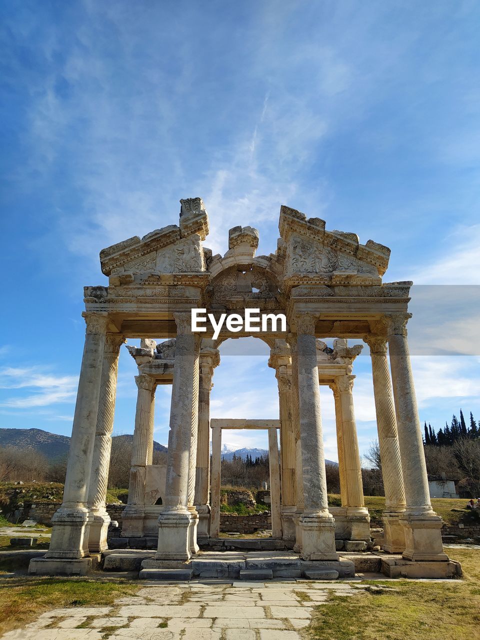 Old ruins of building against cloudy sky