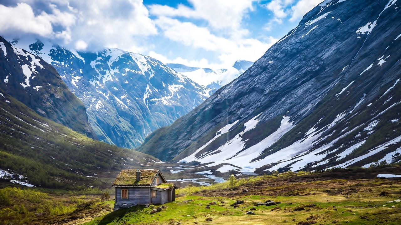 Scenic view of snowcapped mountains against sky