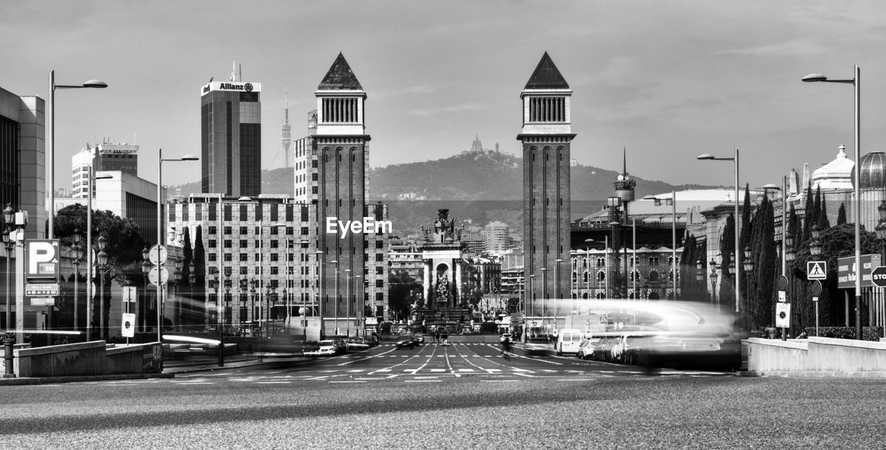 View of city street and buildings against sky baecelona