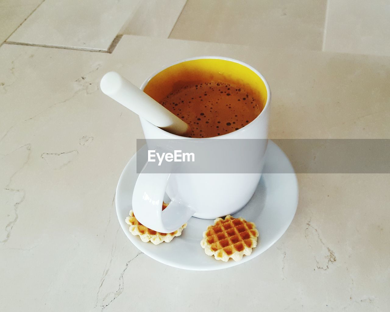 High angle view of coffee cup on table