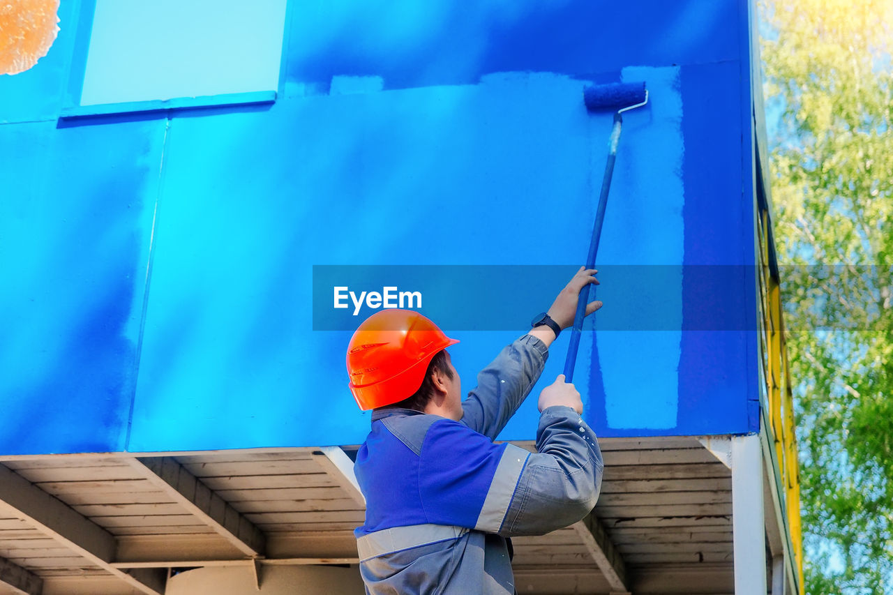 rear view of man working on slide