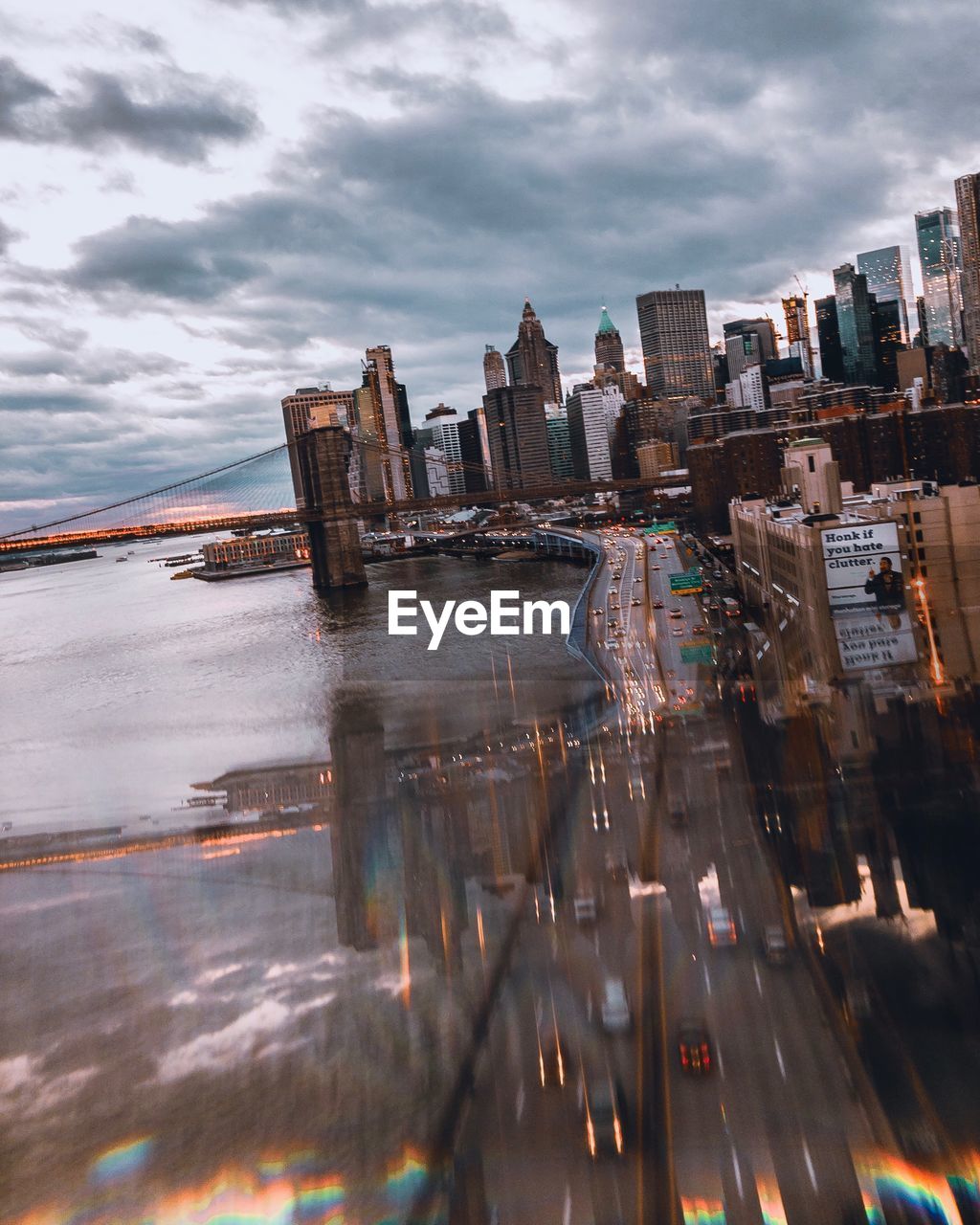 Aerial view of buildings against cloudy sky