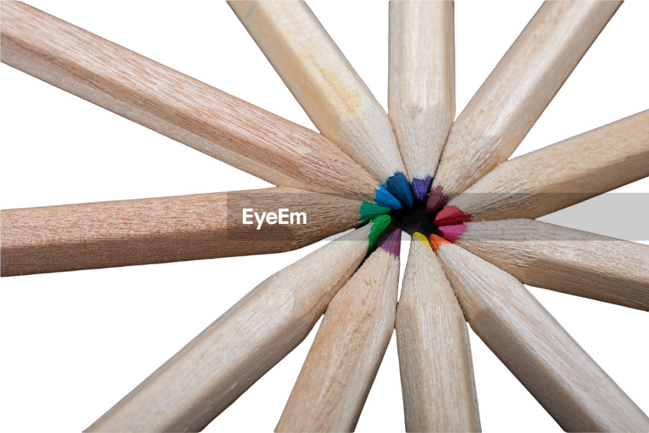 wood, multi colored, white background, pencil, creativity, cut out, no people, close-up, variation, craft, colored pencil, shape, indoors, writing instrument, studio shot, arrangement, white