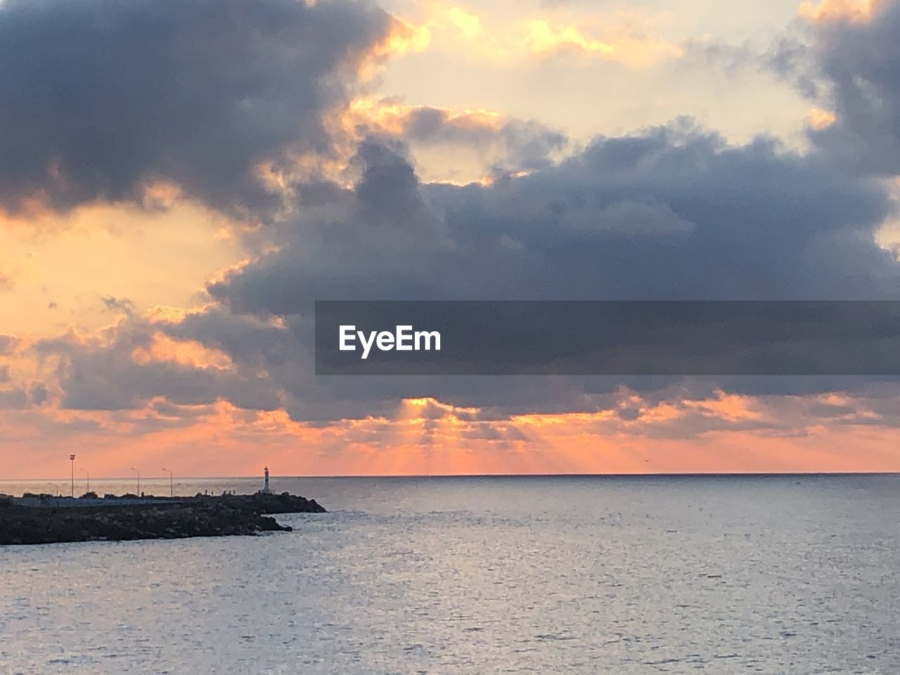 SCENIC VIEW OF SEA DURING SUNSET