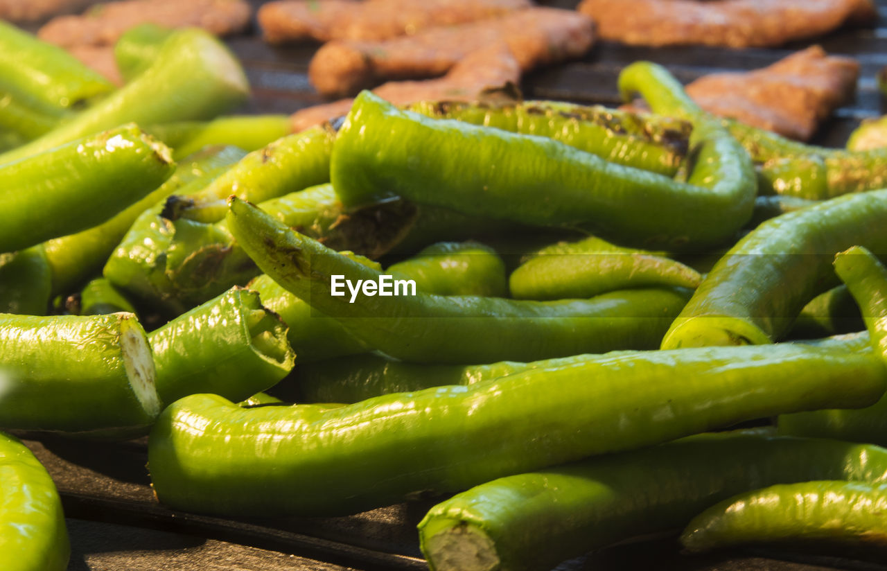 Close-up of green chili peppers for sale at market stall