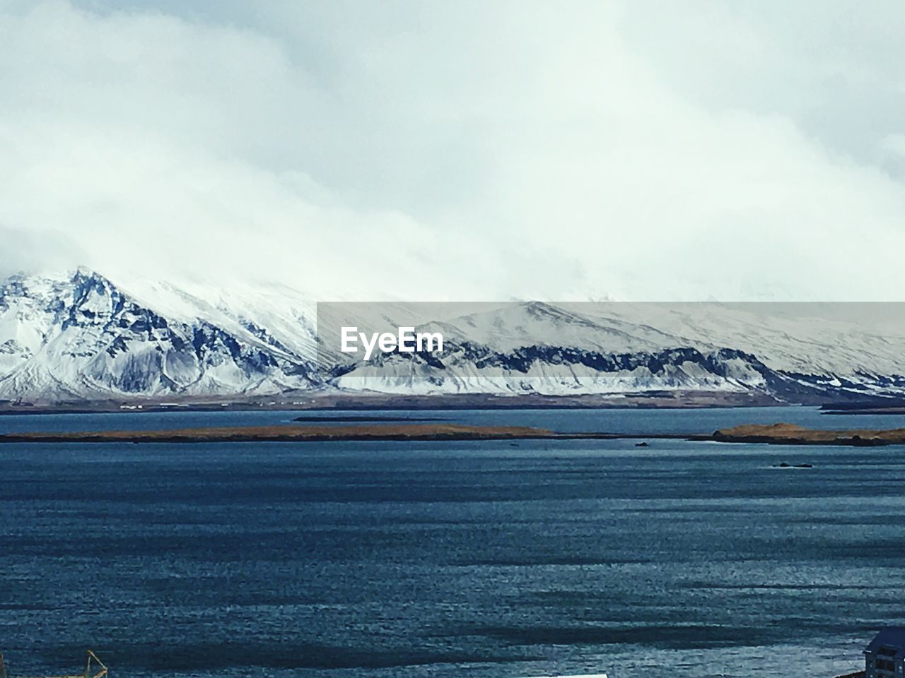 Scenic view of frozen lake against sky