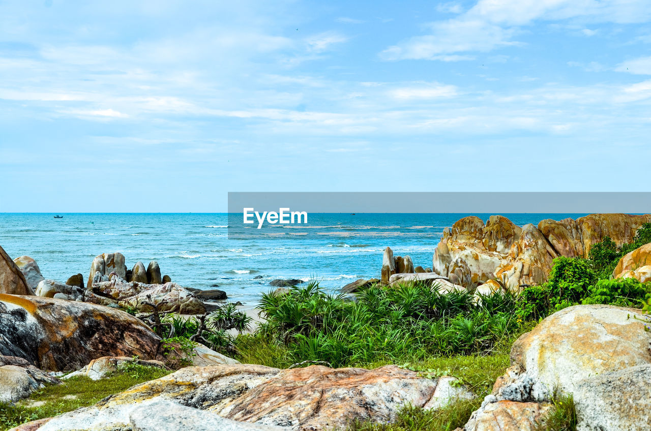 Scenic view of sea against blue sky