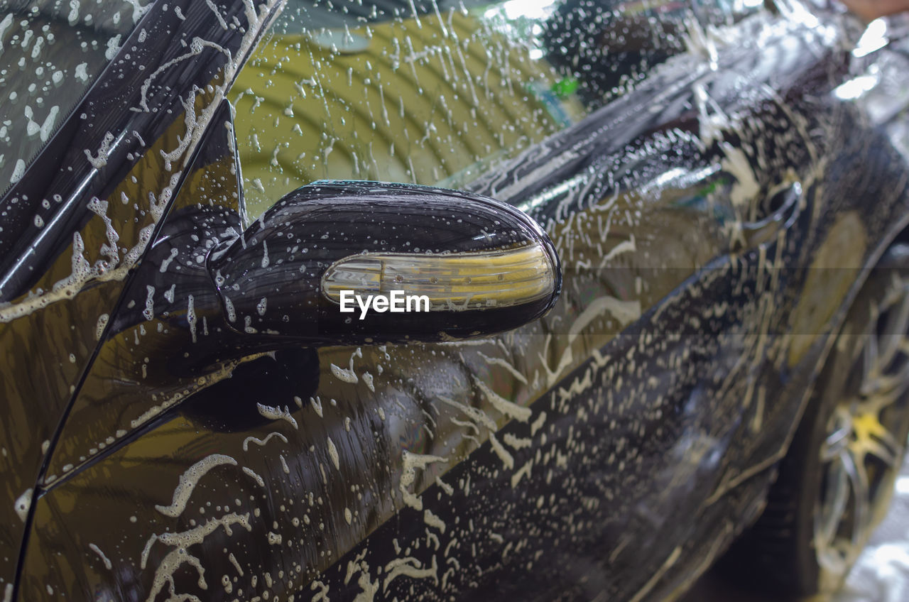 Close-up of car getting washed