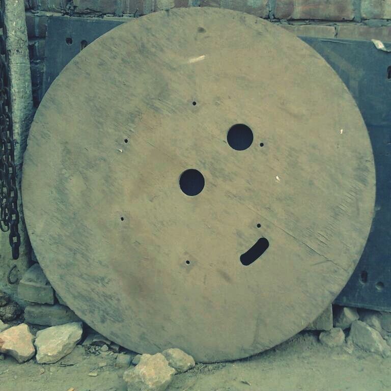 Smiley on circular wood