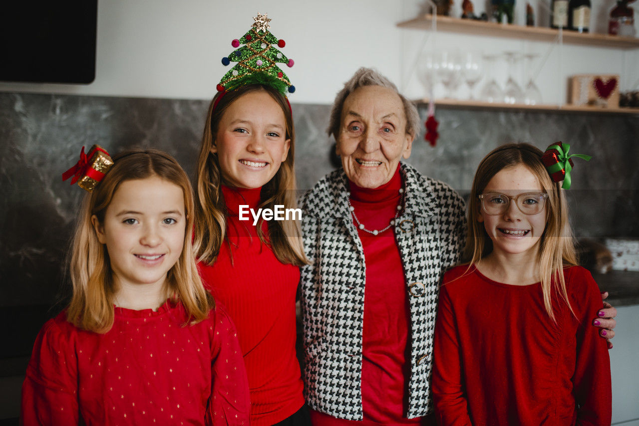 Christmas portrait of grandmother with granddaughters