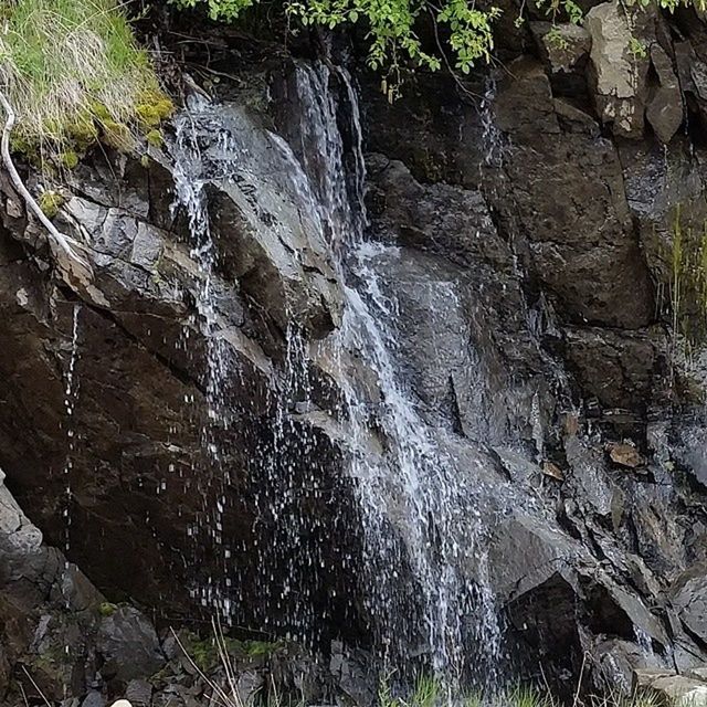 WATER FLOWING THROUGH ROCKS