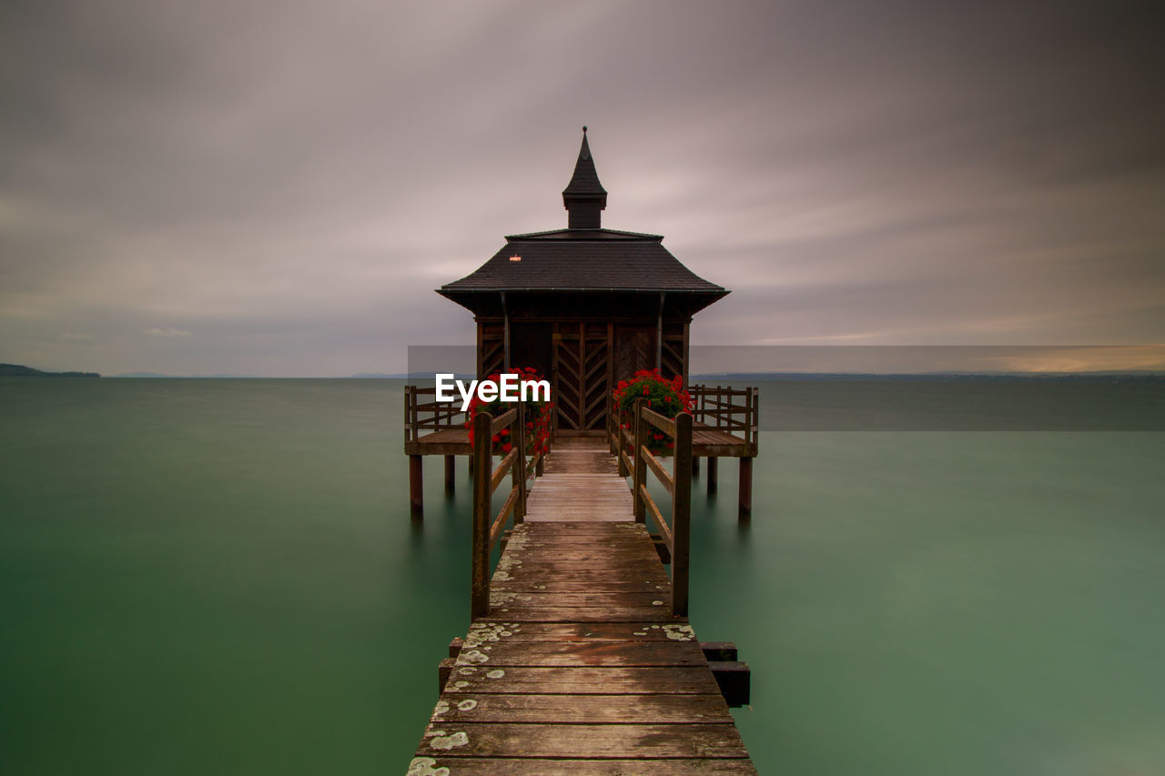 Pier over sea against sky