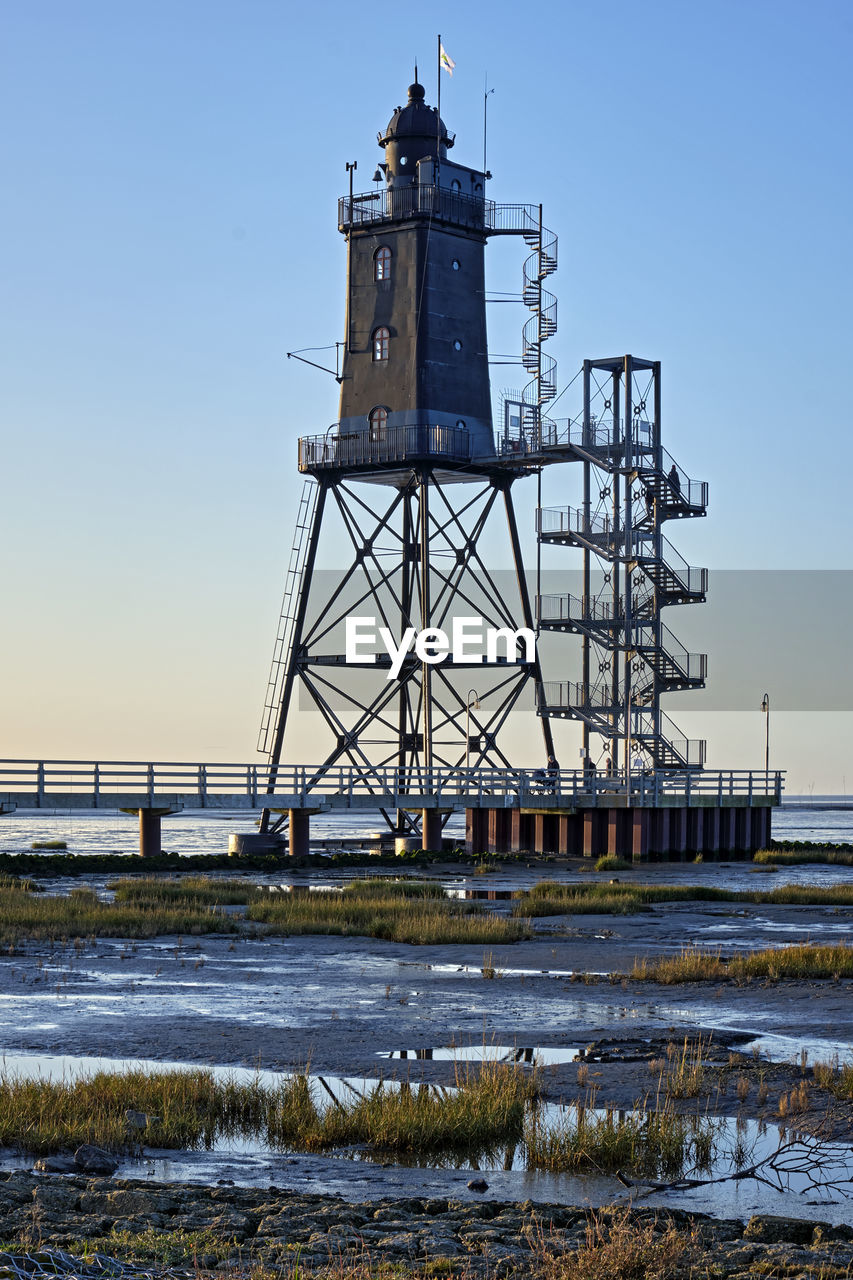 VIEW OF LIGHTHOUSE AT SEASIDE