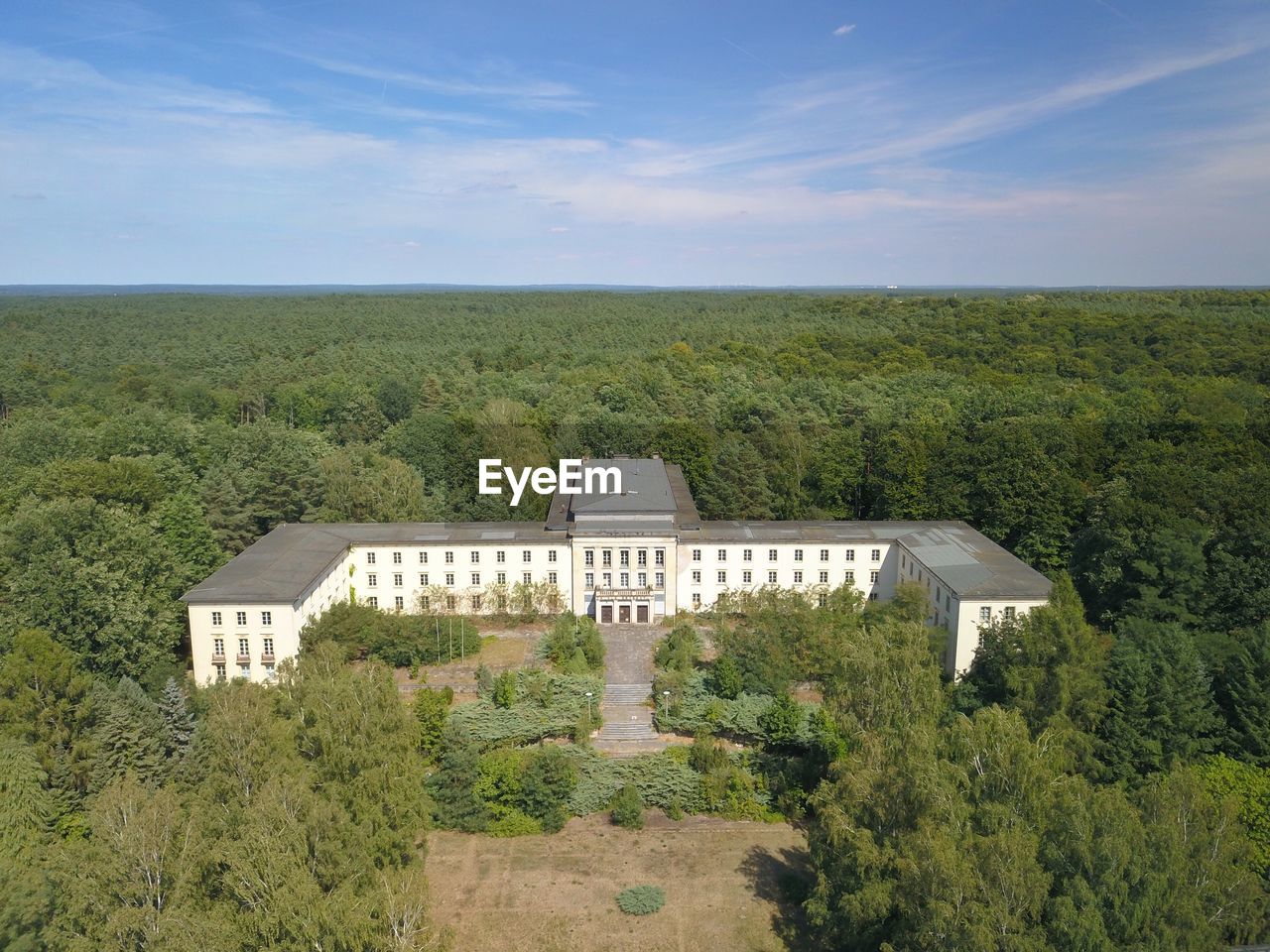 Built structure on landscape against sky