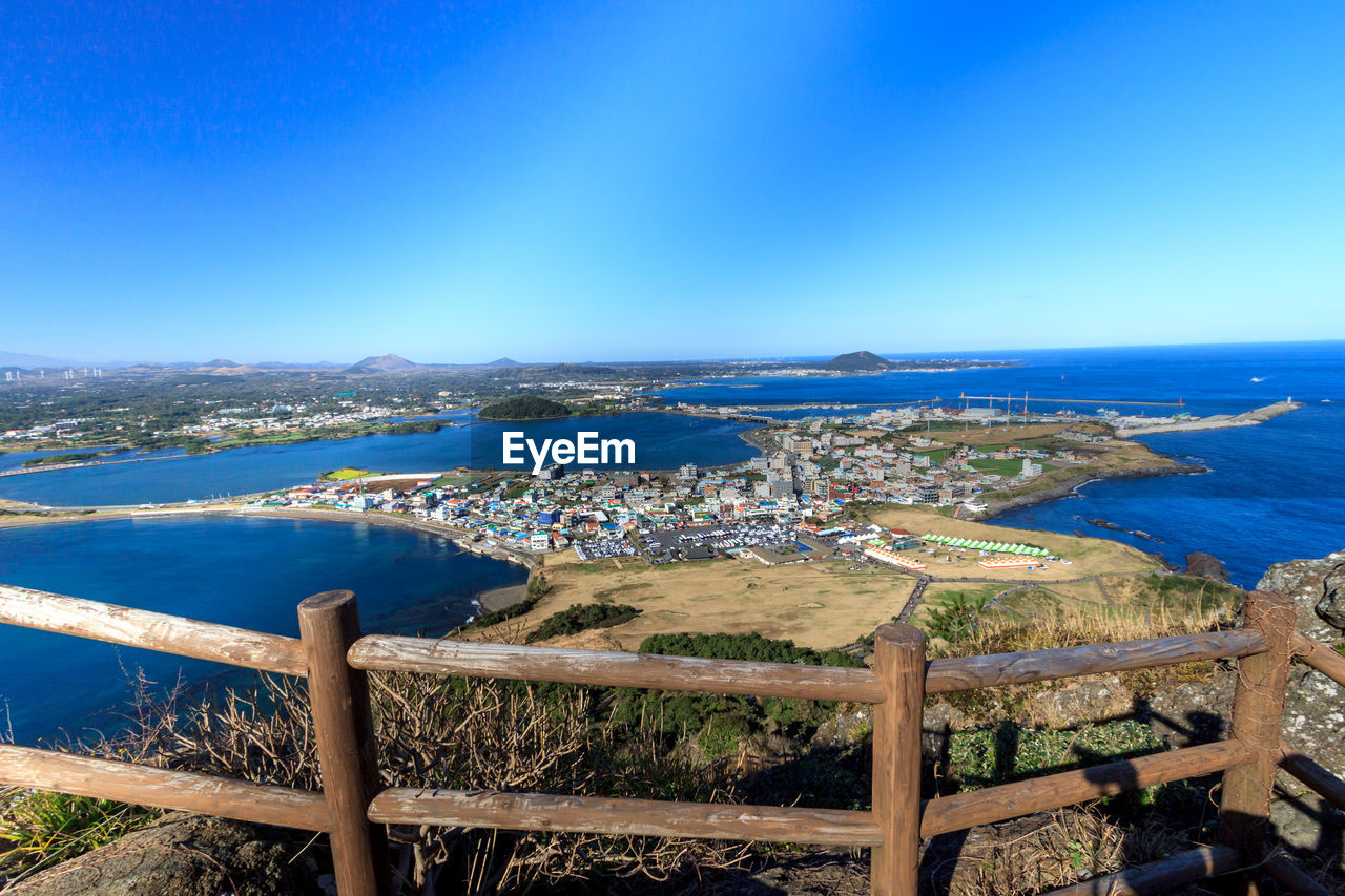 High angle view of sea against blue sky