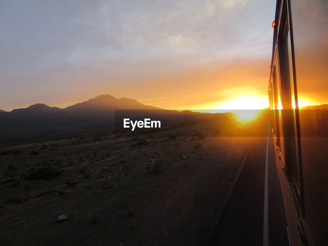 Scenic view of road against sky during sunset