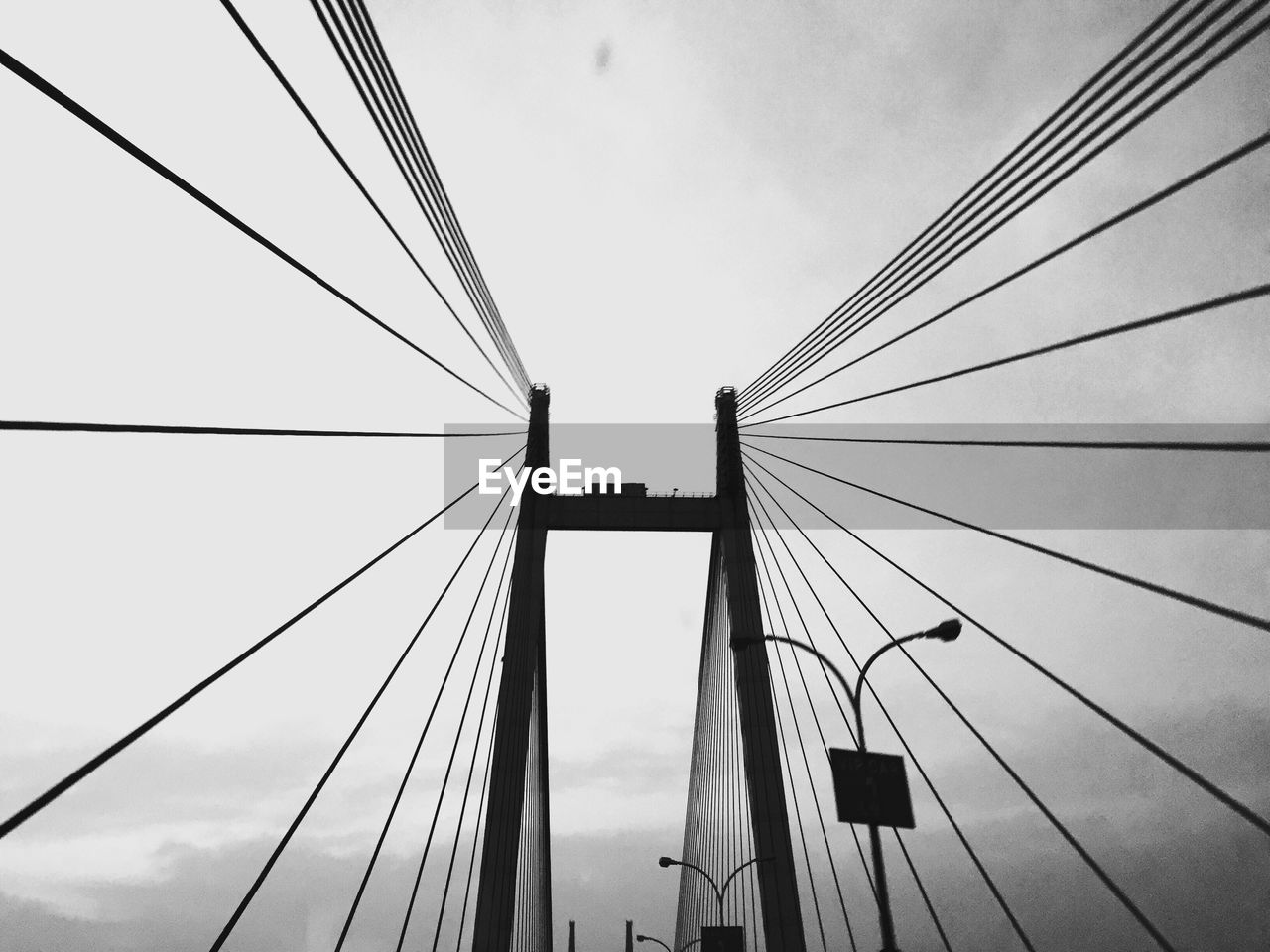 Steel cables of bridge against sky