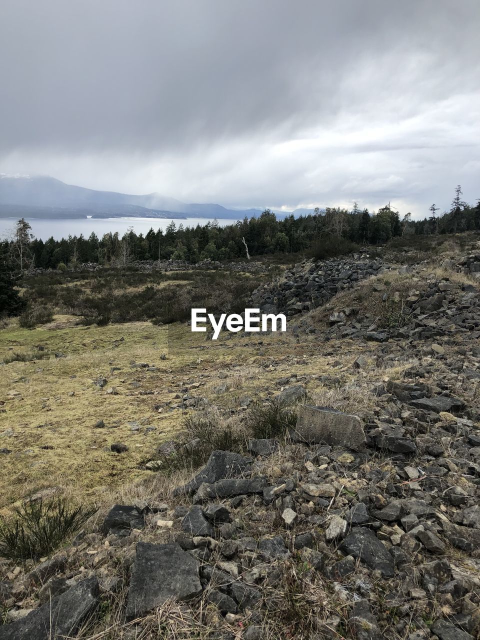 ROCKS ON LAND AGAINST SKY