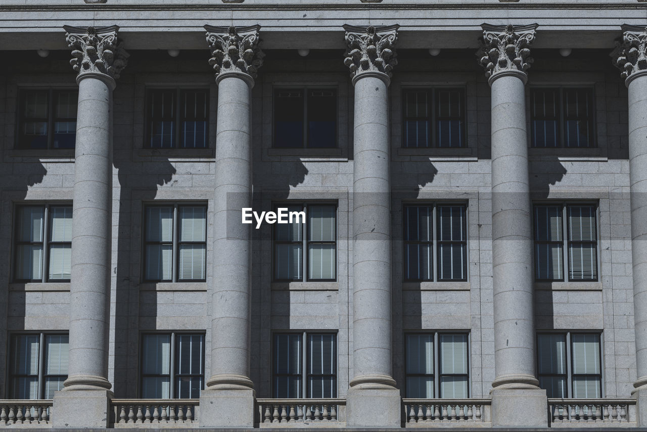 The architecture of buildings windows, stucco molding, and columns on a sunny day in the usa