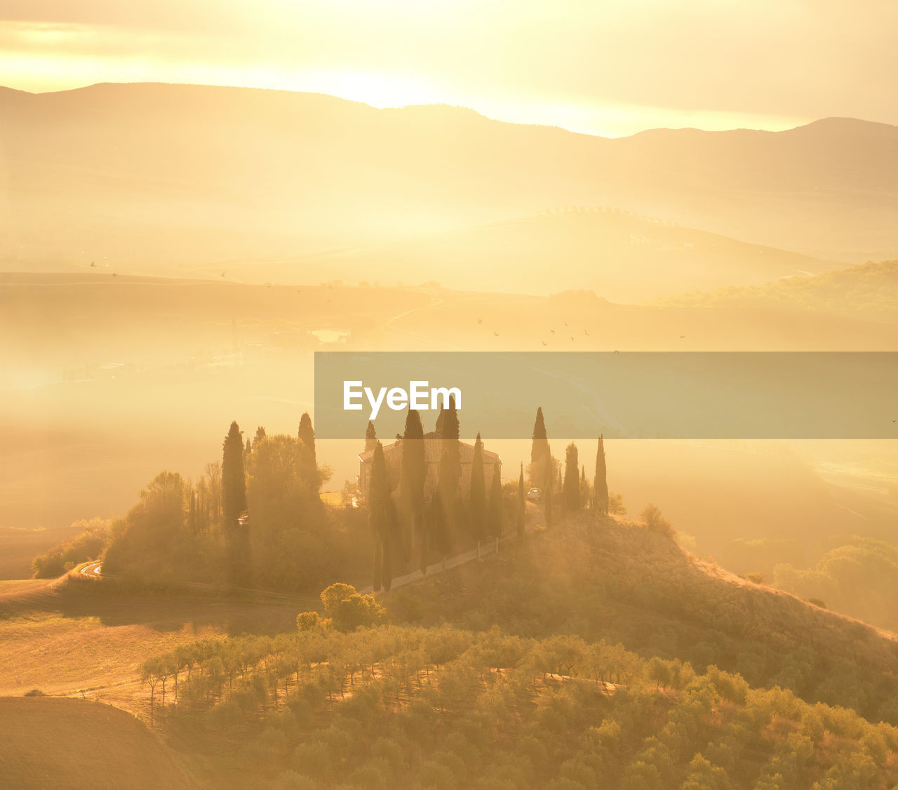 Scenic view of landscape against sky during sunset