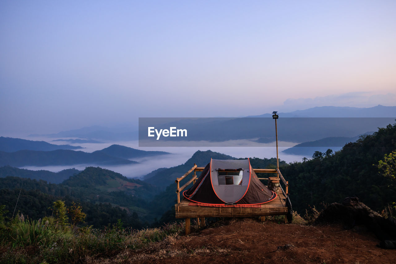 Tent camping viewpoint and valley mountain range and fog background at morning chaing rai thailand
