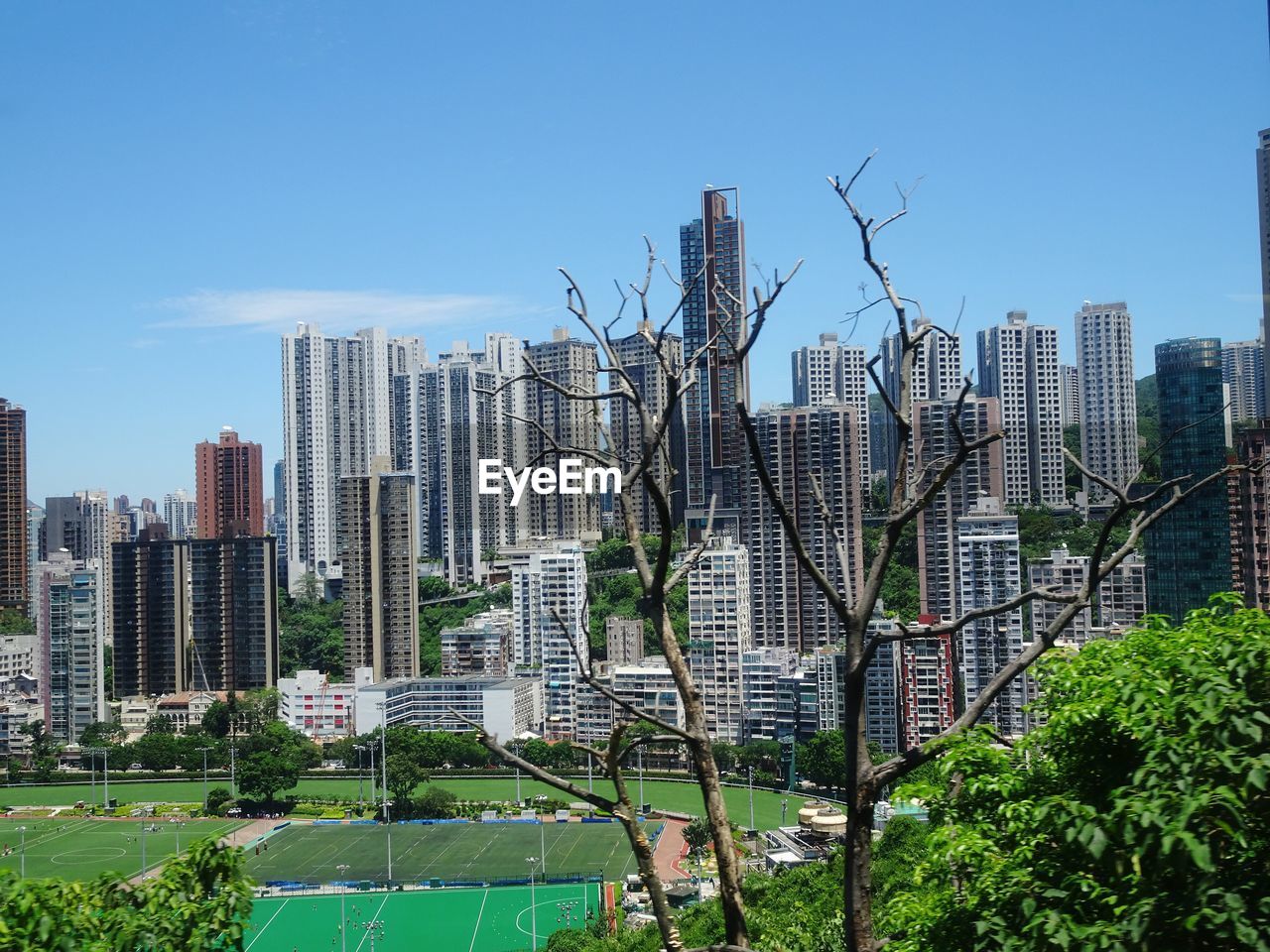 Cityscape against clear blue sky