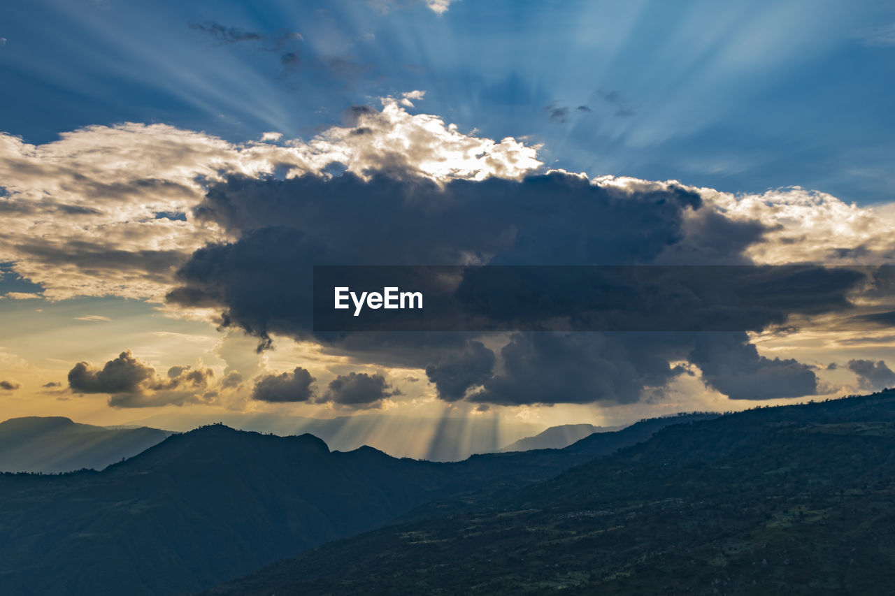 Scenic view of mountains against sky during sunset