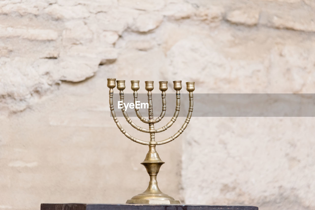 Close-up of candlestick holder on table