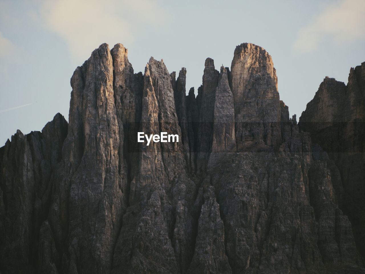 Low angle view of rock formations against sky in dolomites