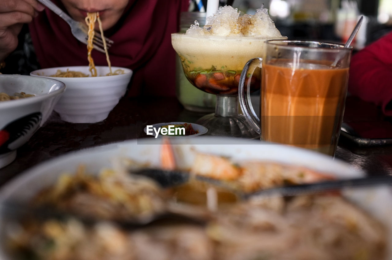 Close-up of noodles served on table