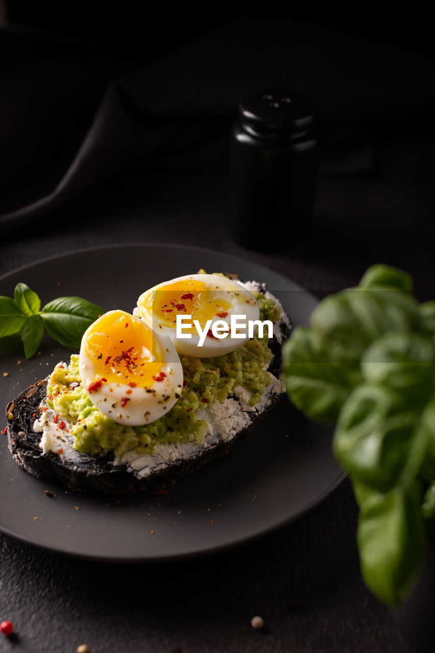 Breakfast with avocado toast with eggs on a plate