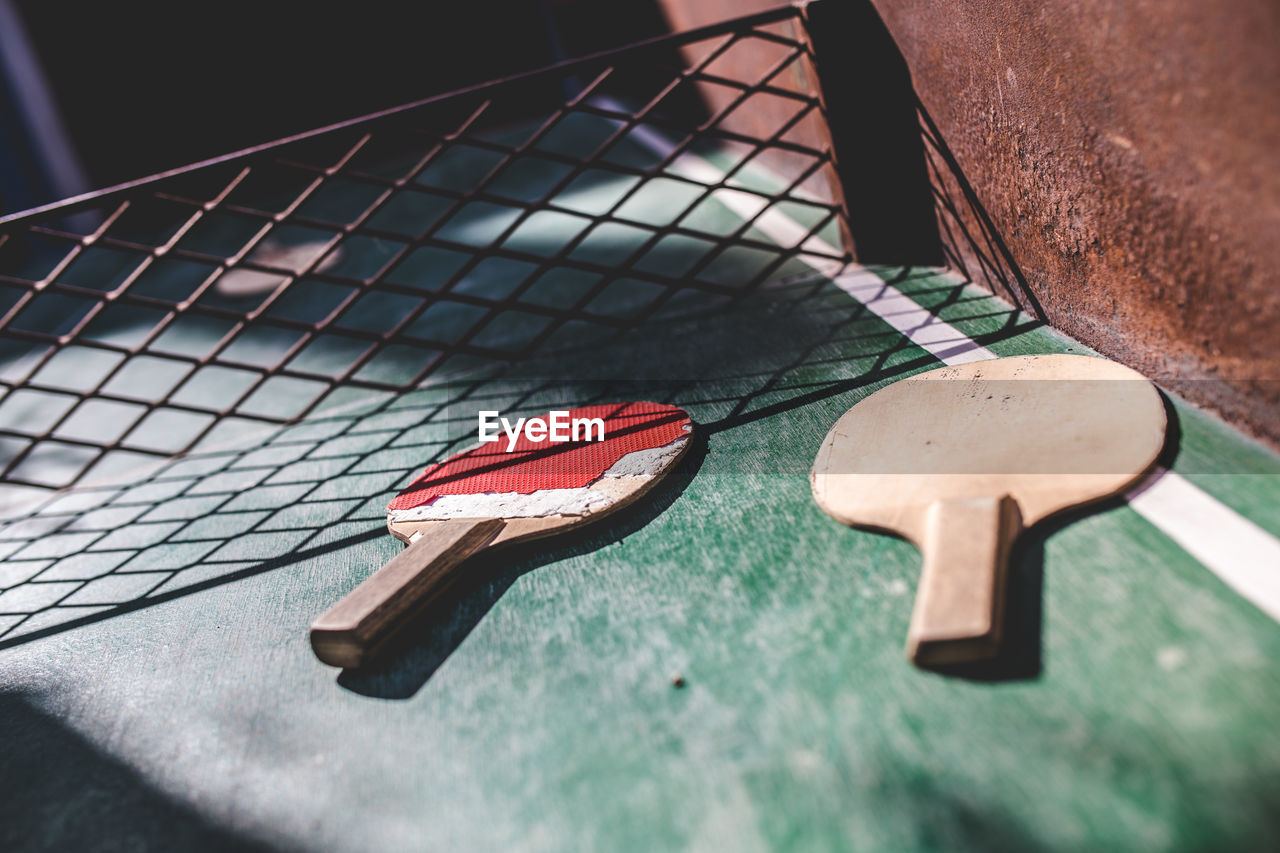 High angle view of tennis rackets on table