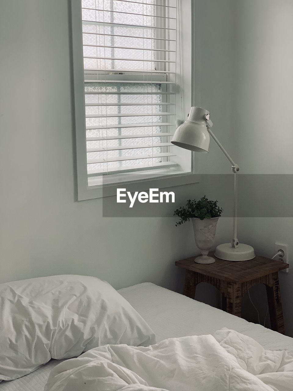 Electric lamp on bed at home