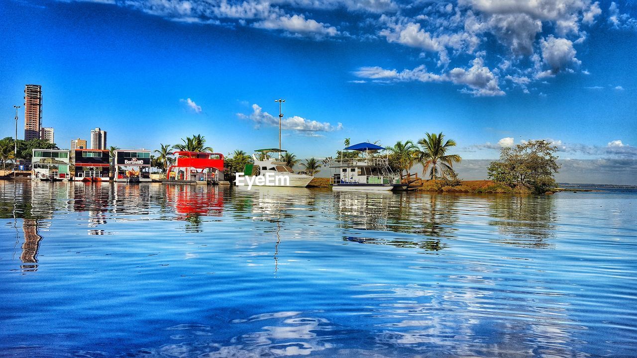 BOATS MOORED IN HARBOR