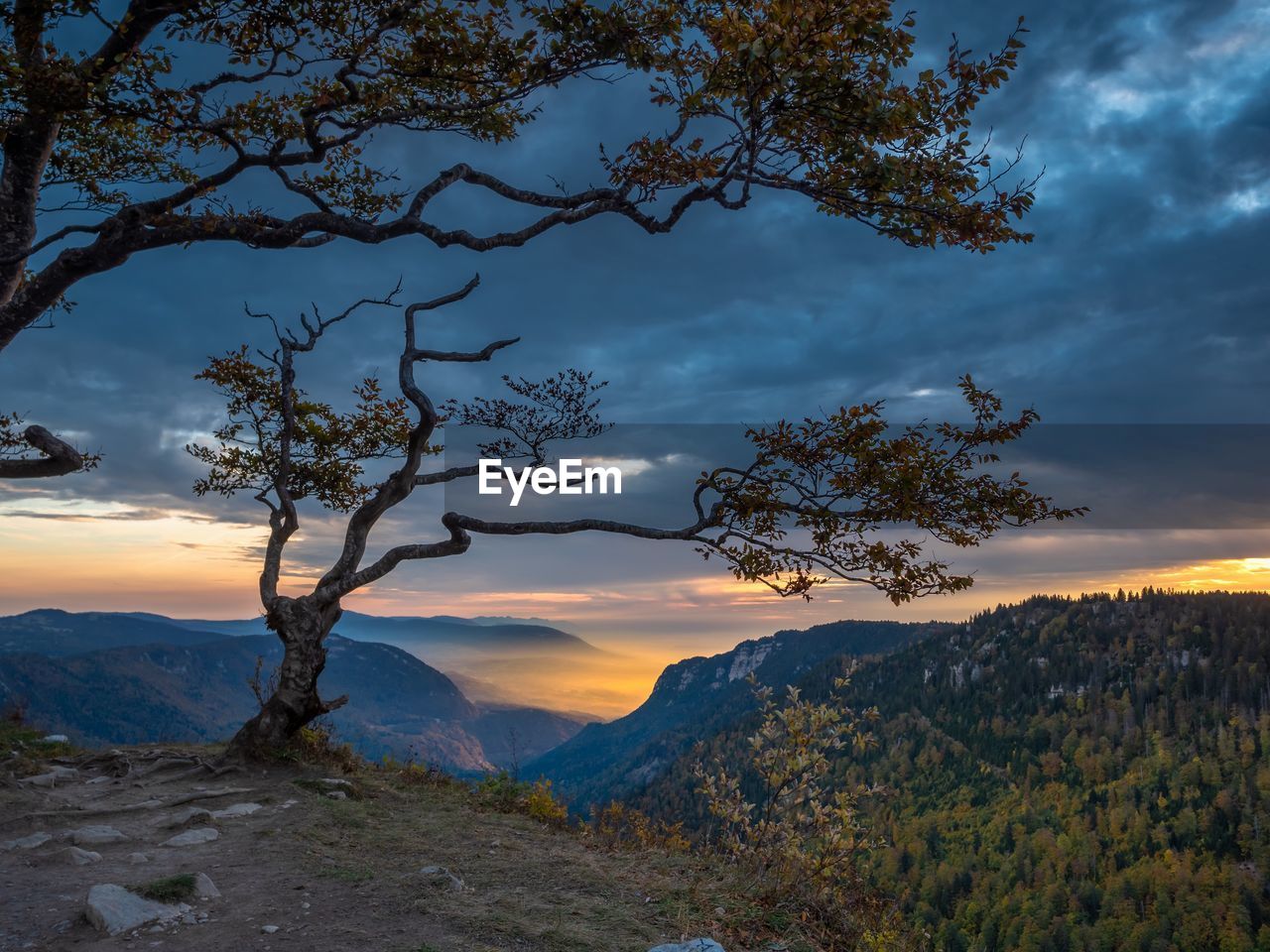 Scenic view of mountains against sky during sunset